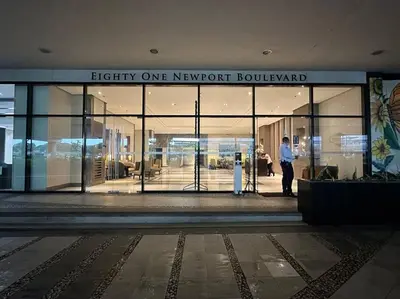 a man standing in front of a building at Airport NAIA Terminal 3 Insane Interior in Manila