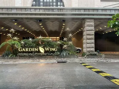 a garden wing sign on the front of a building at Airport NAIA Terminal 3 Insane Interior in Manila