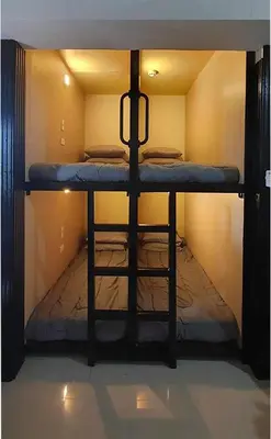 a small bunk bed in a small room at C Place - Capsule A in Manila