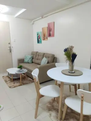a living room with a couch and a table at 2BR Condo by Coco's Haven in Manila