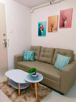 a living room with a couch and a table at 2BR Condo by Coco's Haven in Manila