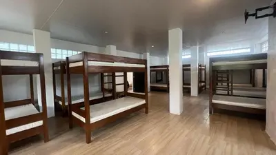 a group of bunk beds in a room at CD NATUREVIEW in Matangtubig