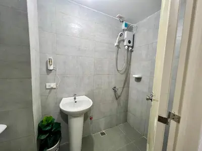 a bathroom with a shower and a sink at Staycation Condotel Room to Stay Paranaque in Manila