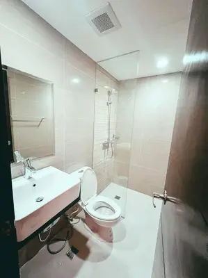 a bathroom with a toilet and a sink at Condo Unit Viceroy Residences Mckinley Hill cd22b in Manila