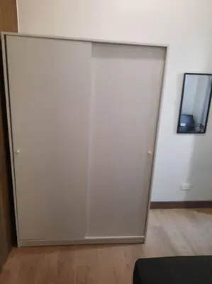 a white wall with a mirror in a room at SMDC Spring Malachai's place in Manila