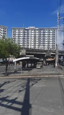 a large building with a hotel in the background at SMDC Spring Malachai's place in Manila
