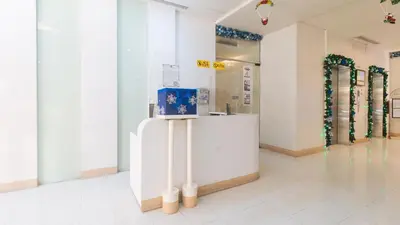 a store room with a counter and some windows at RedDoorz at TJMG by Bel Air Polaris Makati in Manila