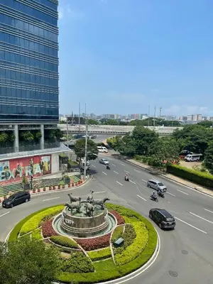 a highway with a fountain in the middle of a city at 150 Newport Boulevard, near Terminal3 Airport in Manila