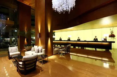 a lobby with couches and a bar in a building at City Garden Grand Hotel in Manila