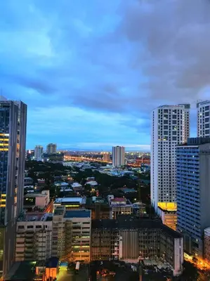 a view of a city with tall buildings at KL Tower Cosy Studio with Balcony Sauna Gym Pool near Greenbelt in Manila