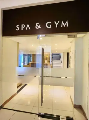 a store front with a sign for a spa and gym at BGC Cosy Spacious 1BR Uptown Parksuites with Balcony in Manila
