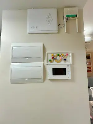 a kitchen with white cabinets and a microwave on a wall at 1BR BGC Uptown Modern Condo Netflix 200Mb Wifi in Manila