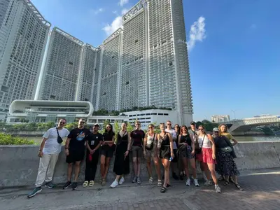 a group of people standing in front of a building at Mad Monkey Manila in Manila