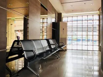 a salon with a black chair in a lobby at Hassle Free Check In and Out With Unli WiFi Netflix in Manila