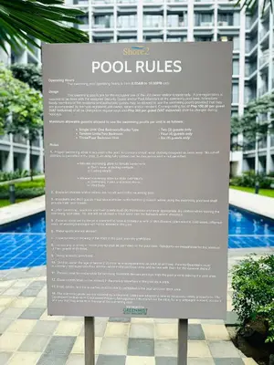 a sign in front of a building at Stylist Luxe Condo near Mall of Asia - Shore 3 in Manila