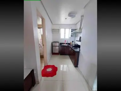 a red rug sitting on the floor of a kitchen at FREE Pool n FREE Sauna Access OceanView Balcony in The Heart of Manila, Front of Robinsons Mall, Walking Distance to US Embassy Limited Slots x Secure Your Limited Offer This Month in Manila