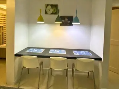 a dining room with a table and chairs at FREE Pool n FREE Sauna Access OceanView Balcony in The Heart of Manila, Front of Robinsons Mall, Walking Distance to US Embassy Limited Slots x Secure Your Limited Offer This Month in Manila