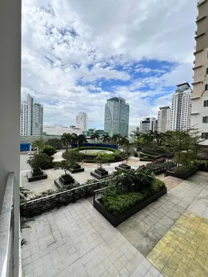 a view of a park in a city with buildings at Brand New Studio w/ Washer in Manhattan Plaza Tower ll in Manila