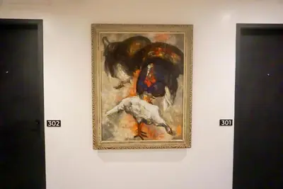 a painting of a dog on a wall at Cayco House by Hotel Durban in Manila