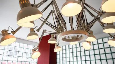 a bunch of lights hanging from a ceiling at Cayco House by Hotel Durban in Manila