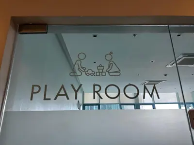 a window with a play room sign on it at Deluxe Suite in One Uptown, BGC with Mall Fountain View in Manila