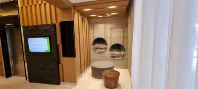 a hallway with a display of shoes on the wall at Premier Luxury Suite near SM Mall of Asia Arena & DFA with Free Parking in Manila