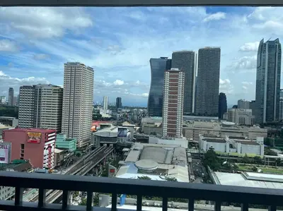 a view of a city with tall buildings at Connie's Fame Residence City Haven in Manila