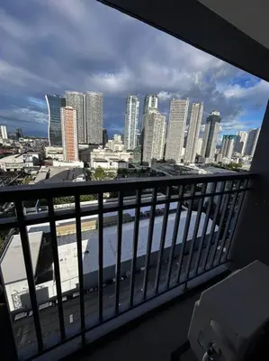 a view of a city skyline from a balcony at Connie's Fame Residence City Haven in Manila