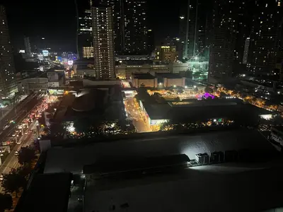 a view of a city at night with lights at Connie's Fame Residence City Haven in Manila