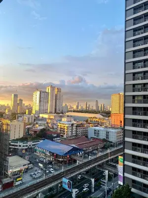 a view of a city with buildings and cars at Connie's Fame Residence City Haven in Manila