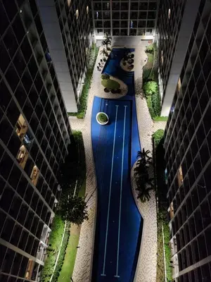 an overhead view of a long blue track in a building at Goshen E320 in Manila