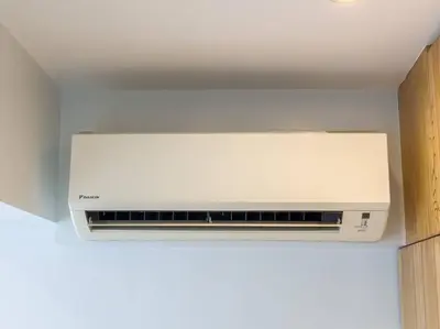 a white air conditioner sitting on top of a ceiling at A2J Luxury 2BR BGC Suite Near High Street, Malls in Manila