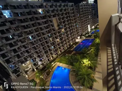 an aerial view of a large apartment building at night at Luxury 1 BR Suite Near NAIA in Manila