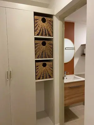 a bathroom with a toilet and a sink at Luxury 1 BR Suite Near NAIA in Manila