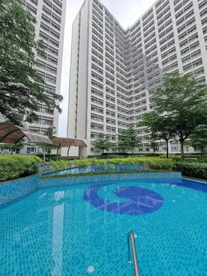 a large swimming pool in front of tall buildings at Grace Residences Pool View Free Wi-Fi near BGC and McKinley 2050 in Manila