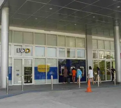 a group of people standing outside of a building at Grace Residences Condotel Paris & Singapore Concept Near McKinley in Manila