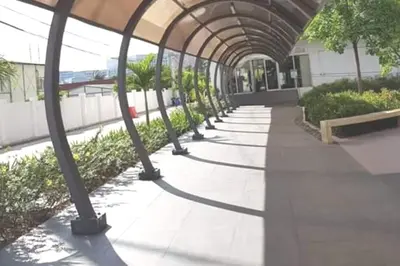 a walkway in a building with a canopy at Grace Residences Condotel Paris & Singapore Concept Near McKinley in Manila