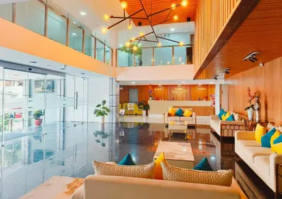 a large lobby with couches and a living room at Maine City Residences Tramo in Manila