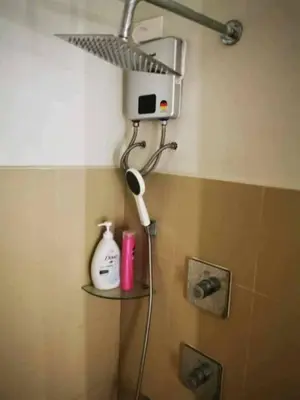 a shower head in a bathroom with at Shore 3 in Manila