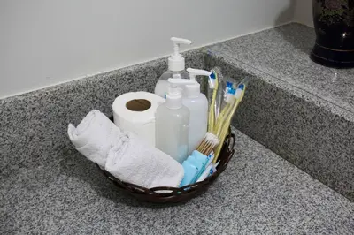a basket of toothbrushes and toilet paper on a counter at Asteria Residences Annabel CozyPlace highspeed wifi in Manila