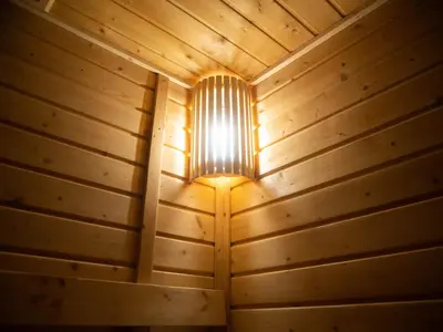 a light in a wooden room with a ceiling at Casa Maris in Bacoor