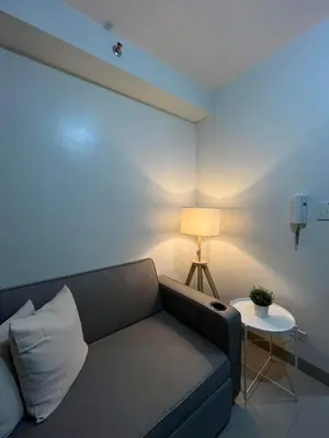 a living room with a couch and a table at Casa Florencia in Manila