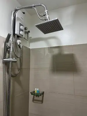 a shower with a shower head in a bathroom at Casa Florencia in Manila