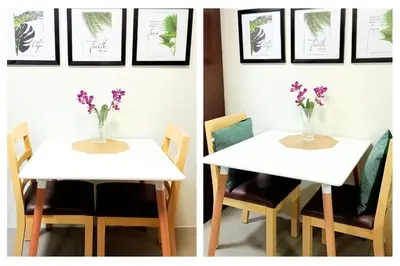 a white table with a vase of flowers on it at Fully-furnished Condo Accommodation in Makati in Manila