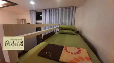 a small bedroom with a bunk bed in a room at Condo in McKinley Hill near Grand Canal Mall (Balai Bellini) in Manila