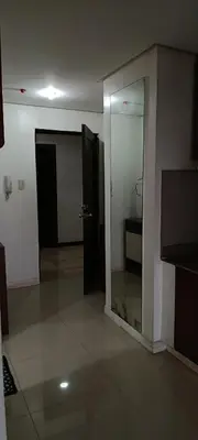 an empty room with a door and a mirror at Birch Tower by The Bay in Manila
