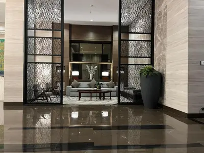 a living room with a couch and a table at Bayfront Suite in Pasay Near NAIA Terminal, PICC, Star City, MOA and US Embassy - Pet-Friendly, Wi-Fi & Netflix, Free Swimming Pool, Sauna and Gym, Work from Home Ready in Manila