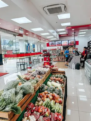 a grocery store filled with lots of vegetables on display at Lian Louise at SMDC Shore 3 MOA with Parking in Manila