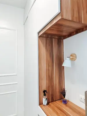 a room with white walls and wood paneling at Lian Louise at SMDC Shore 3 MOA with Parking in Manila