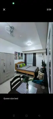 a living room with a bed and a couch at Sweet Kathleen at The Beacon Makati in Manila